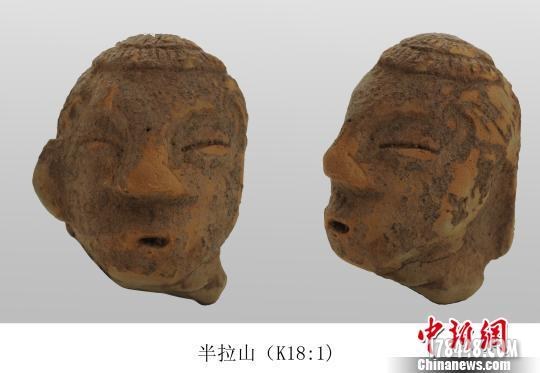 辽宁首次出土5000年前石人像 高鼻梁樱桃小口.jpg